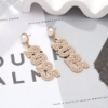 Picture of Gold 2025 New Year Earrings 